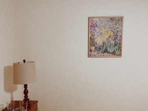 white and brown table lamp on brown wooden table