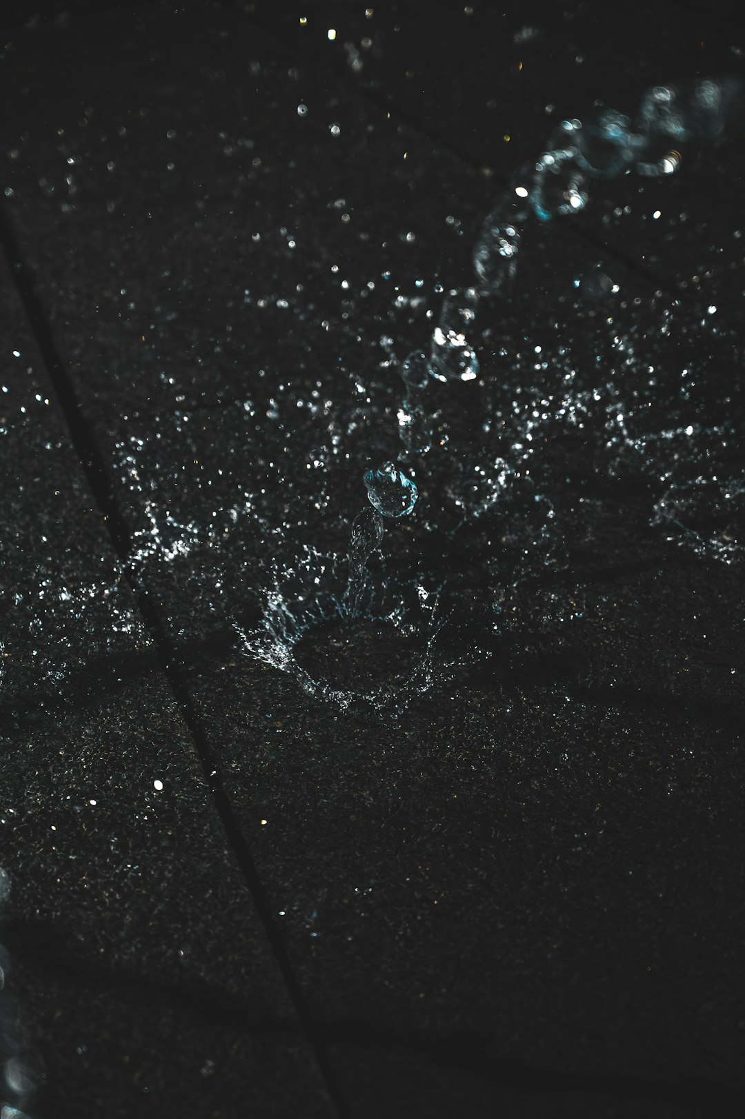 water droplets on black surface