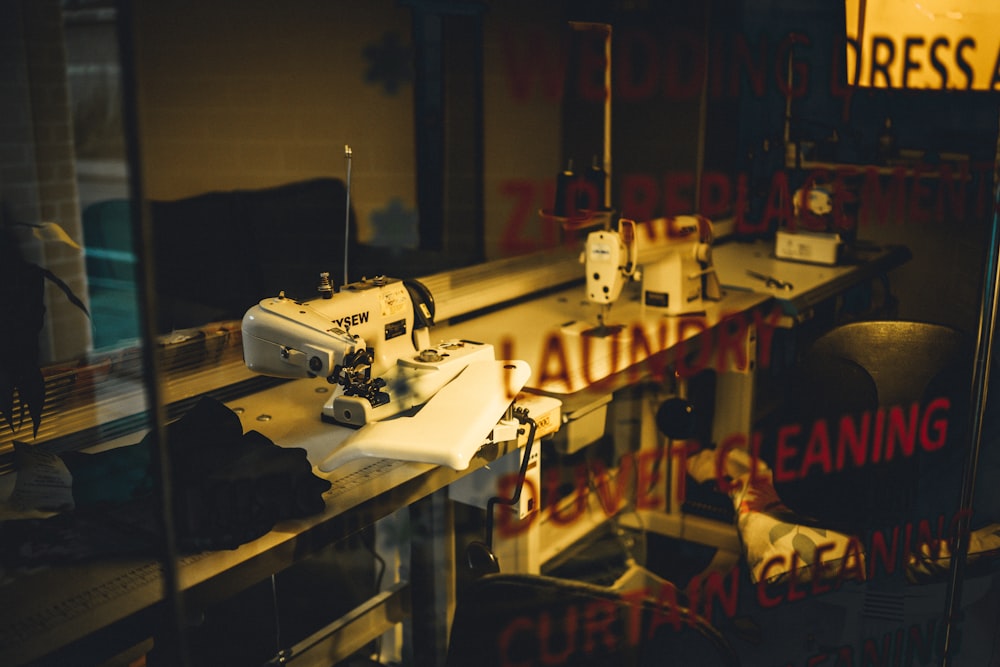 sewing machine on table near chairs