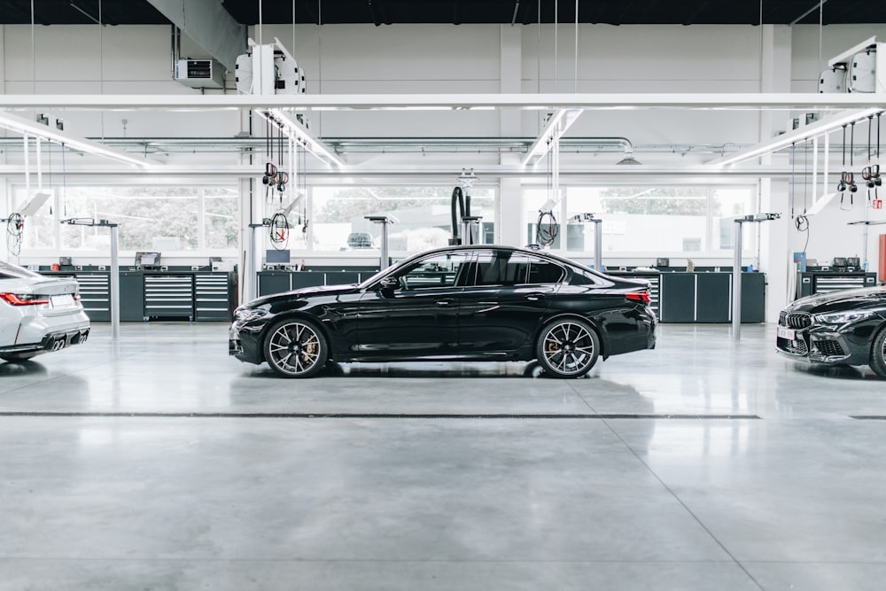 black sedan parked in a parking lot