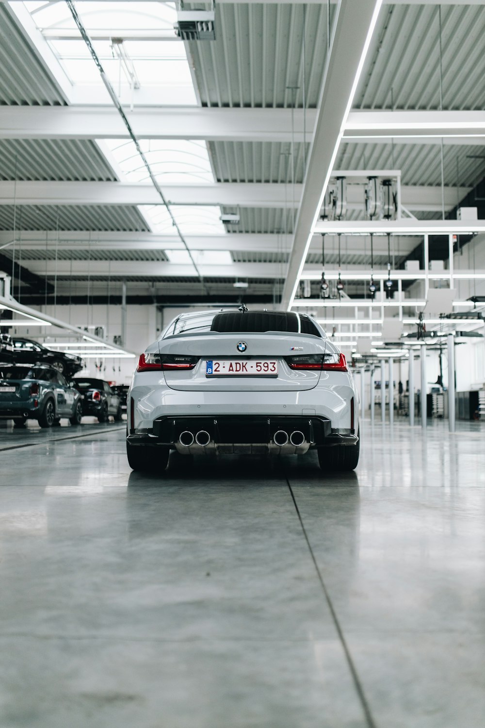 white car on gray concrete road