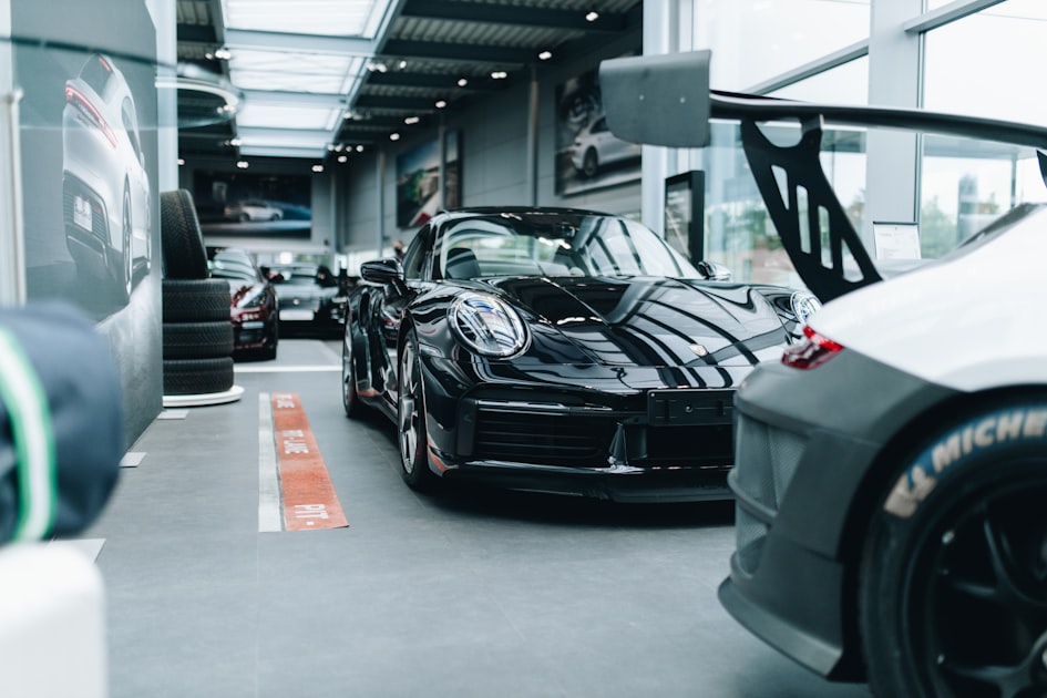 black porsche 911 parked in garage