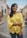 woman in yellow and white floral long sleeve shirt smiling