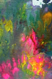 A vibrant and abstract watercolor painting featuring a mix of colors such as green, pink, yellow, and blue. The colors blend and flow into each other, creating an effect reminiscent of foliage or flowers. The image has a textured, almost fabric-like appearance with irregular shapes and vivid patches of color.