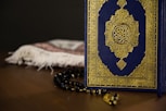 blue and gold book on white textile