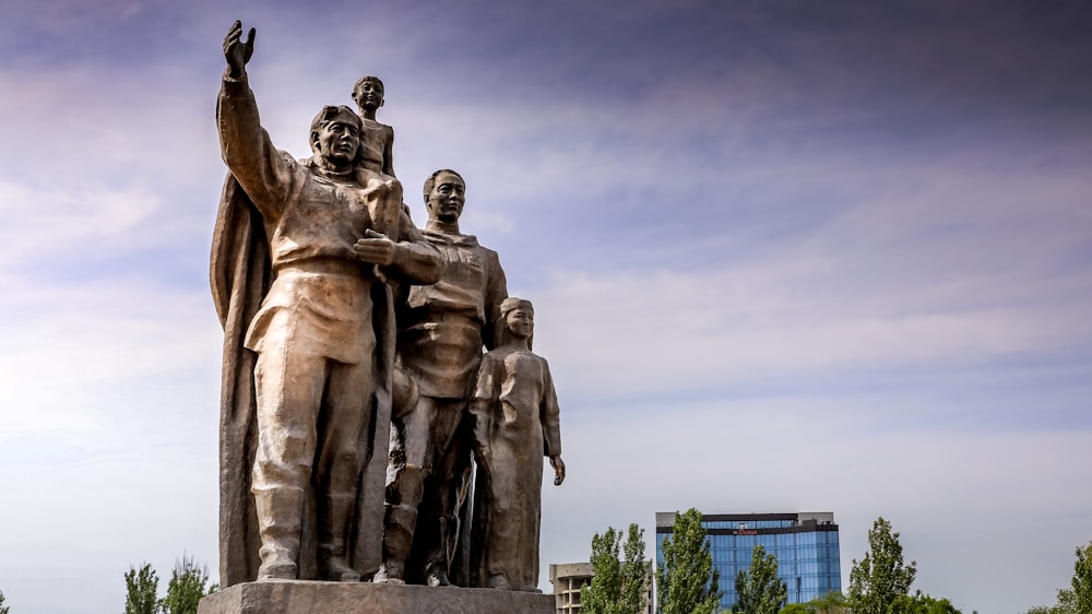 brown concrete statue of man