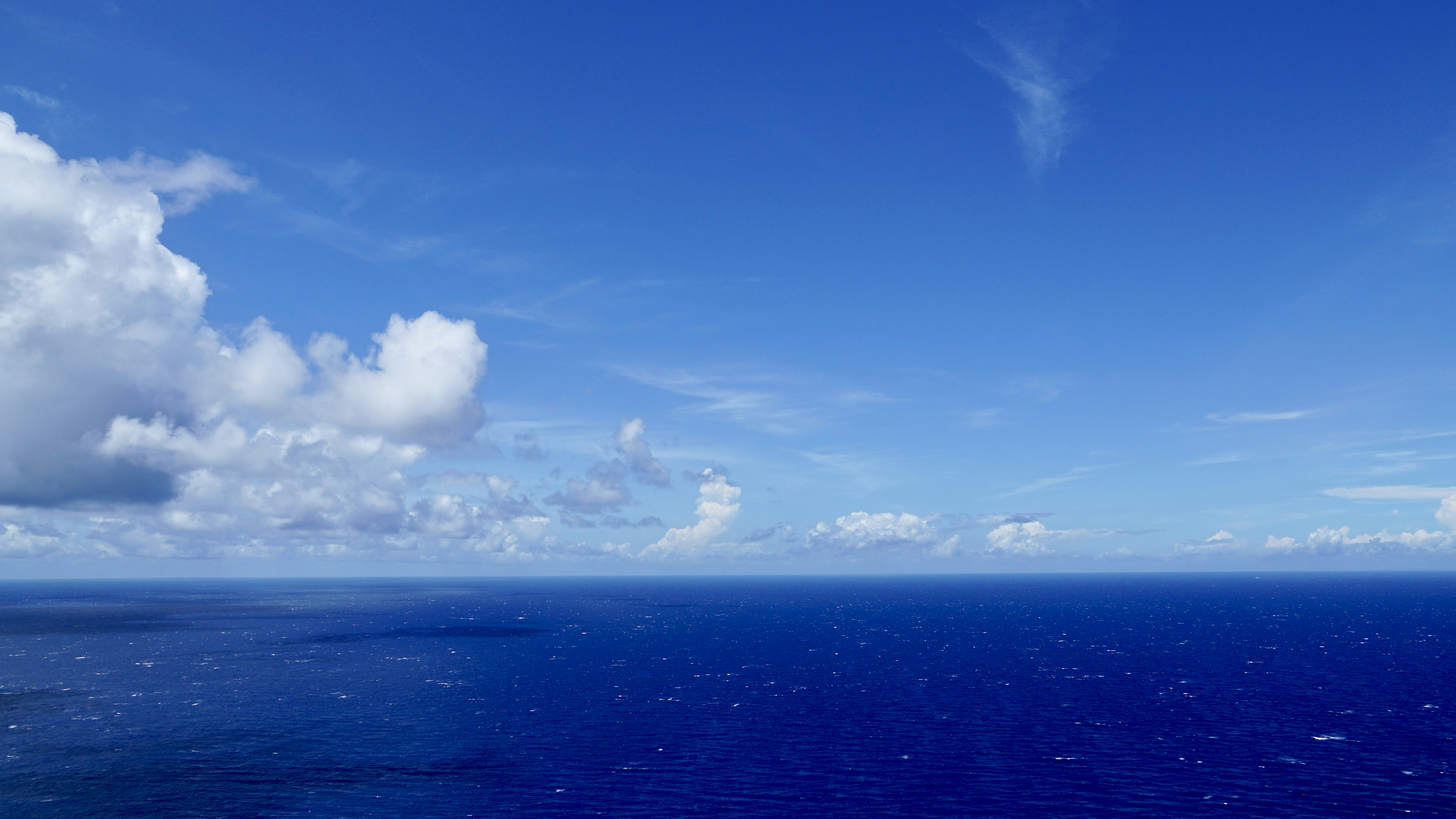 Blue ocean under blue sky and white clouds during daytime photo – Free ...