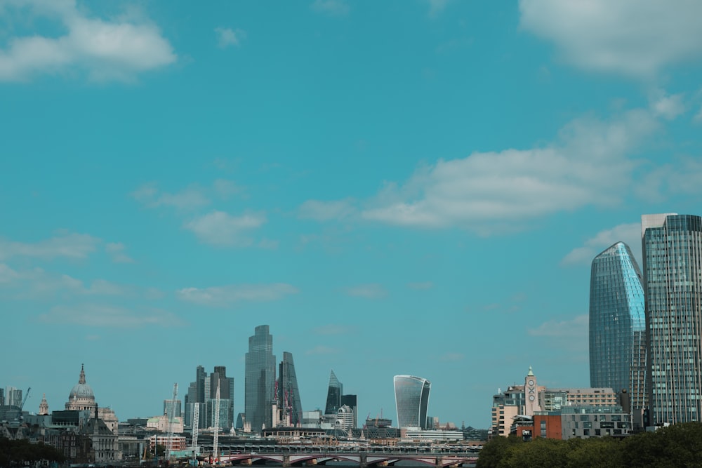city skyline under blue sky during daytime