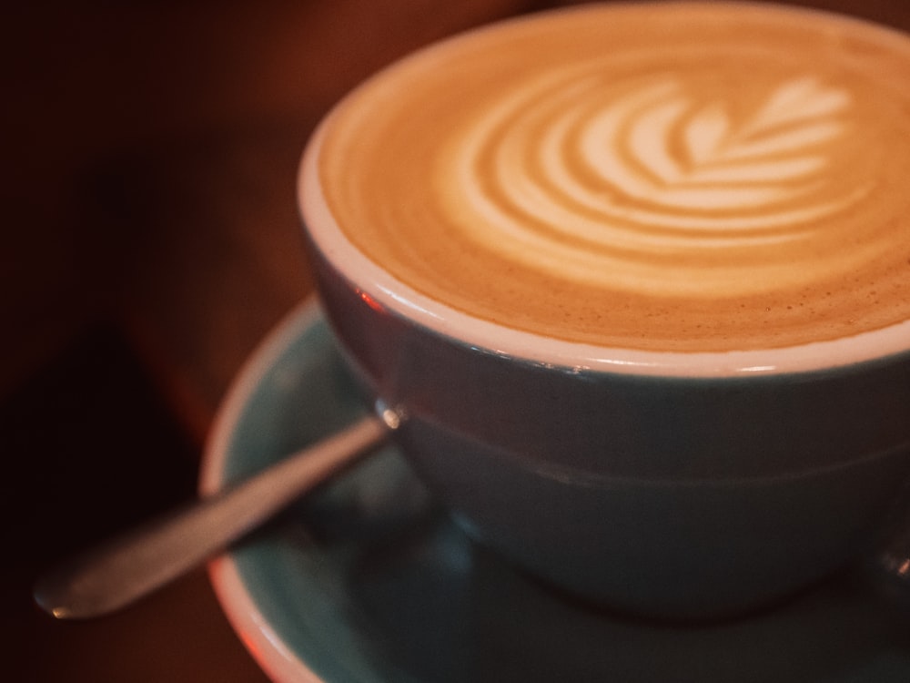 white ceramic cup with brown and white liquid