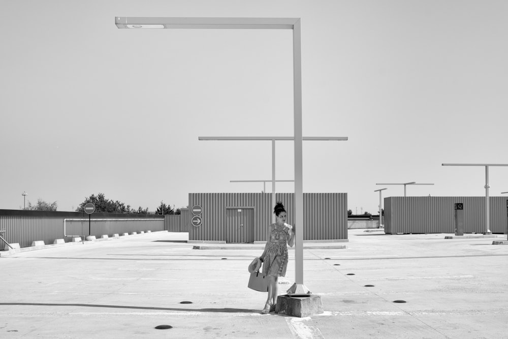 woman in black dress standing on basketball court