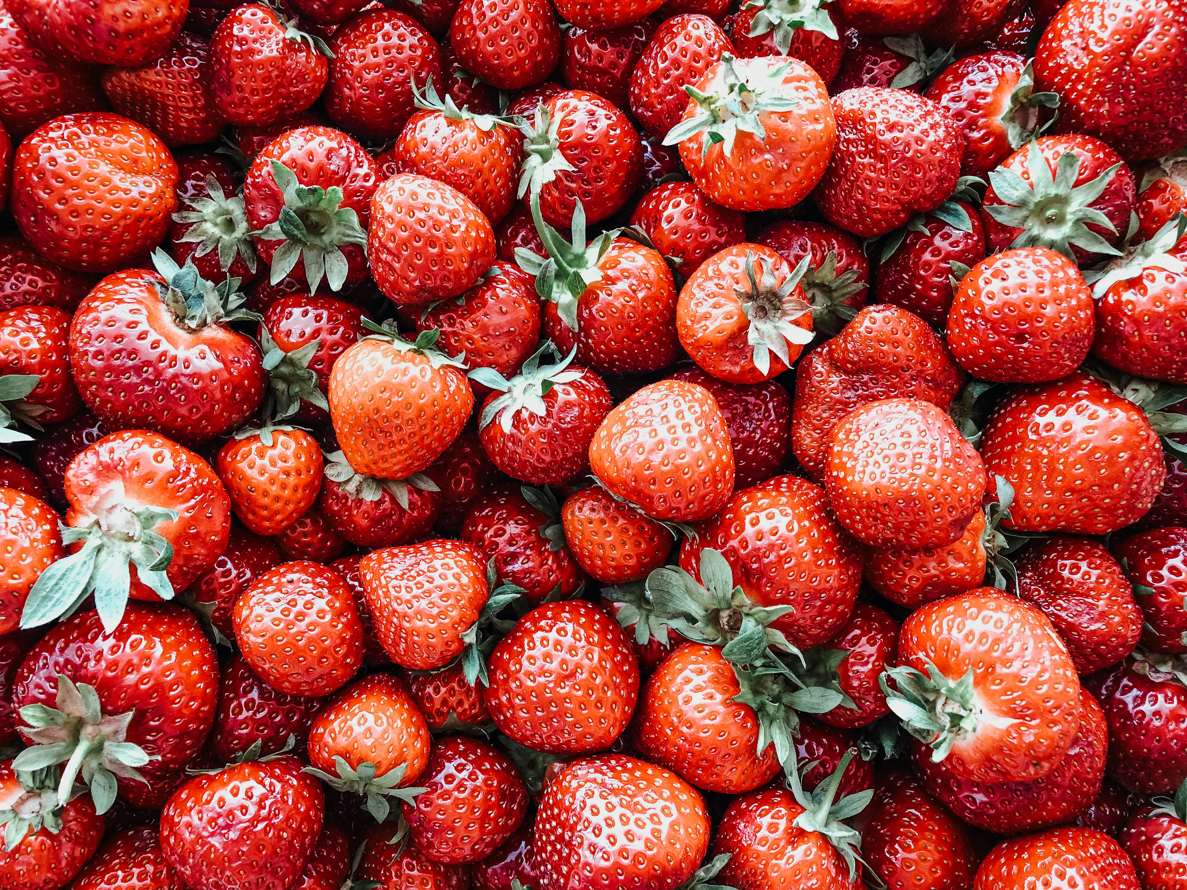 red strawberries on black surface