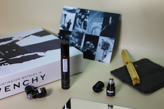black and white tube bottle beside white box