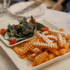 yellow and green fries on white ceramic plate