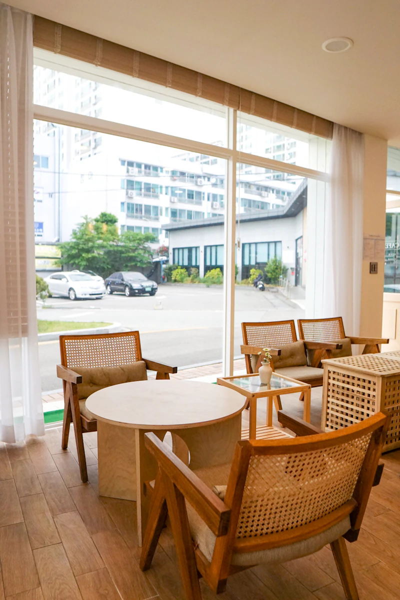 Bright, airy café interior with plants and large windows