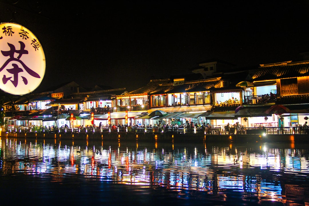 city with lights turned on during night time