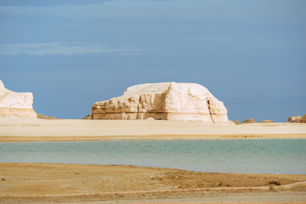 brown rock formation on sea during daytime