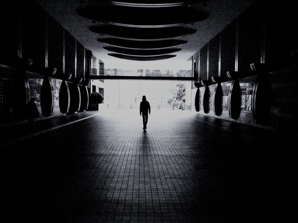 silhouette of people walking on hallway