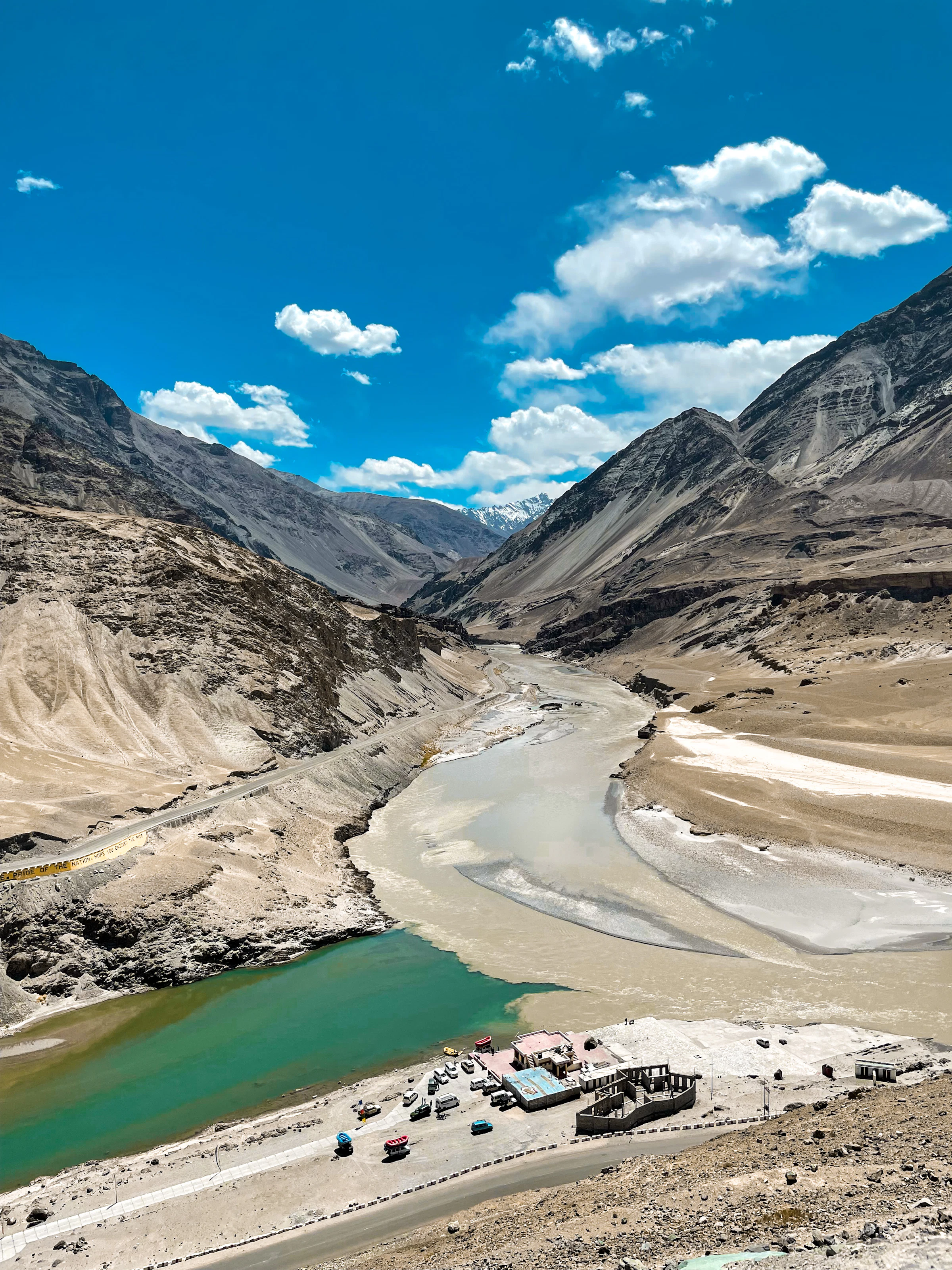 Brown and grey Himalayan mountains under a deep blue sky