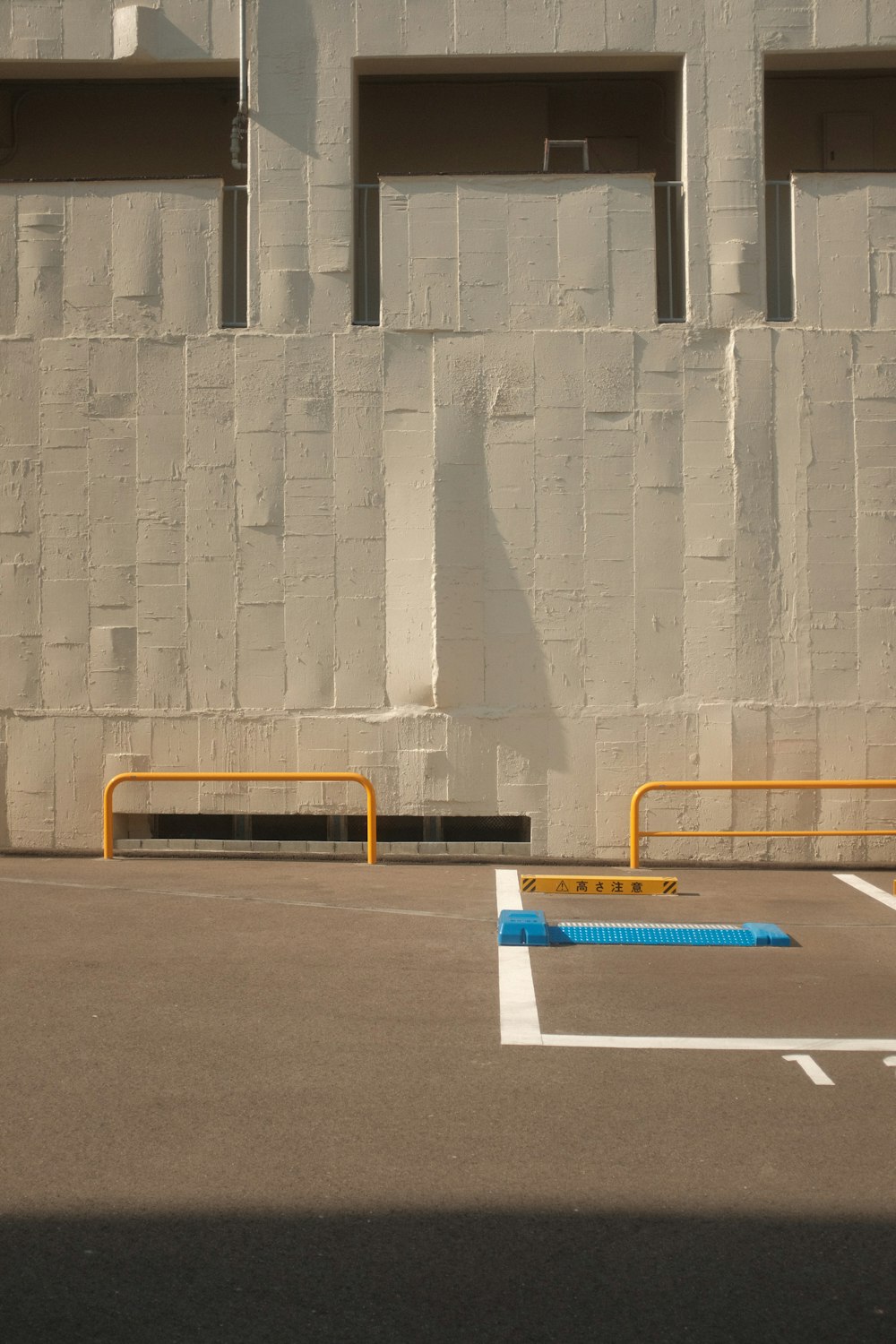 blue and white plastic tube on gray concrete floor