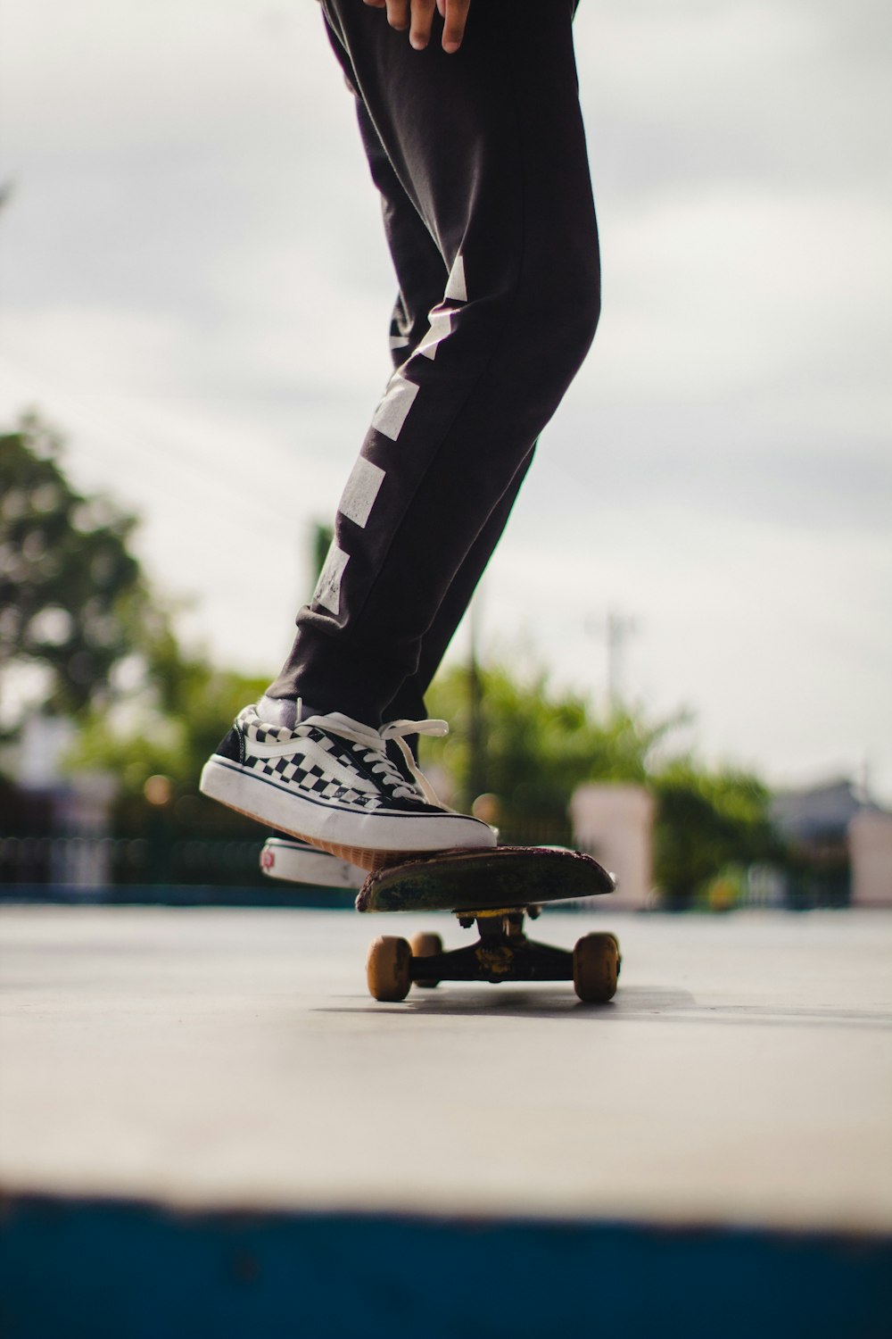 person in black and white adidas sneakers riding skateboard during daytime  photo – Free Skateboard Image on Unsplash