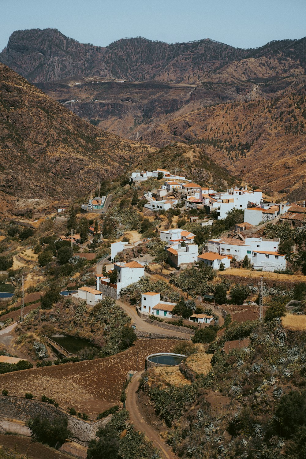 white and brown houses on brown mountain during daytime