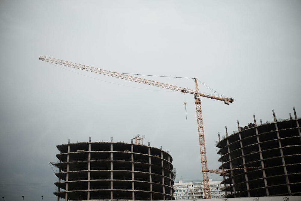 yellow crane near black building