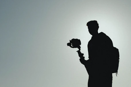 An influencer collaborating with a tech gadget brand during a scenic travel adventure, capturing authentic moments.