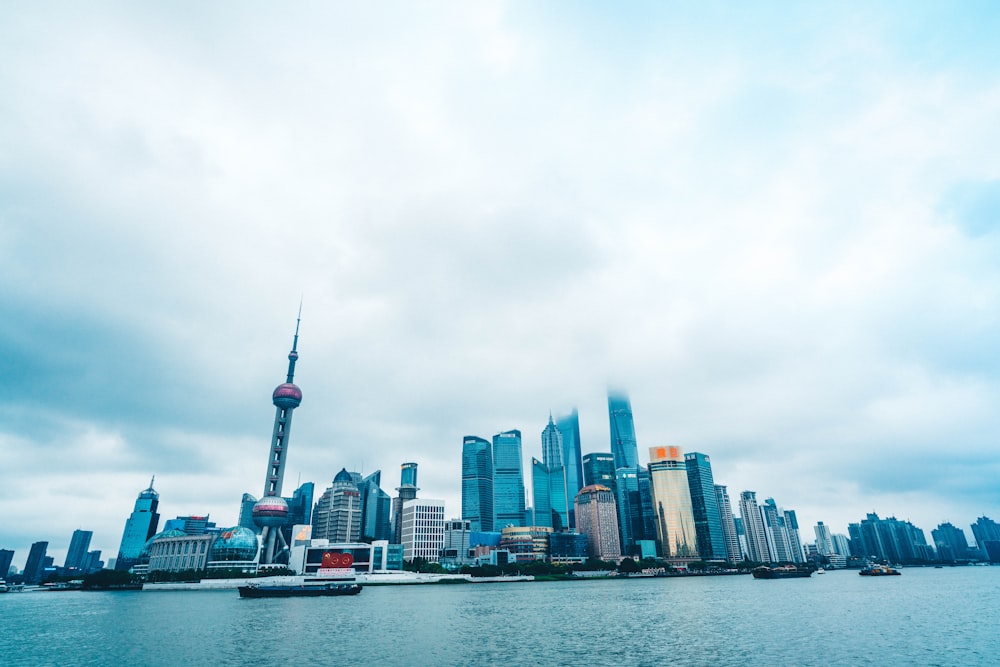 city skyline across body of water during daytime