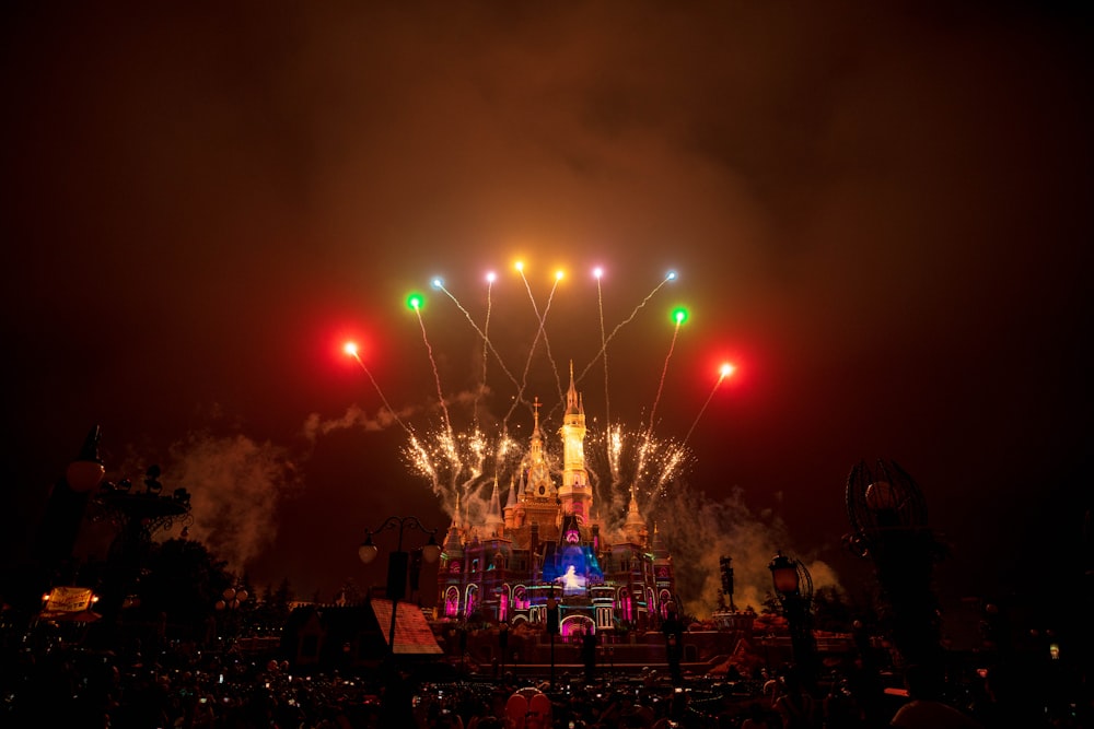 people watching fireworks display during nighttime