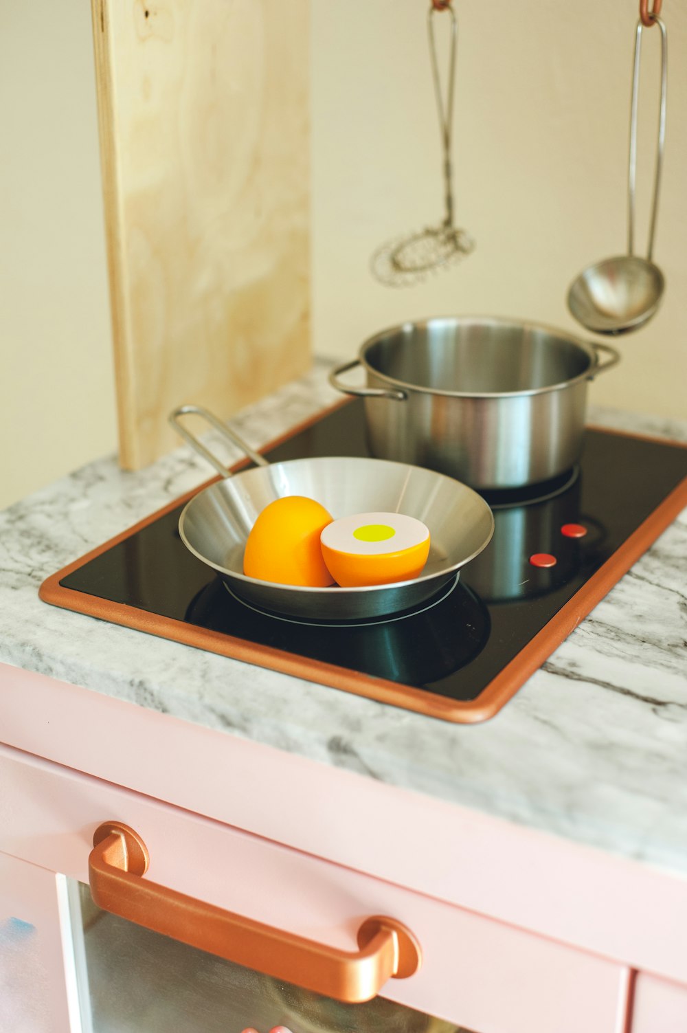 stainless steel bowl on white ceramic tray