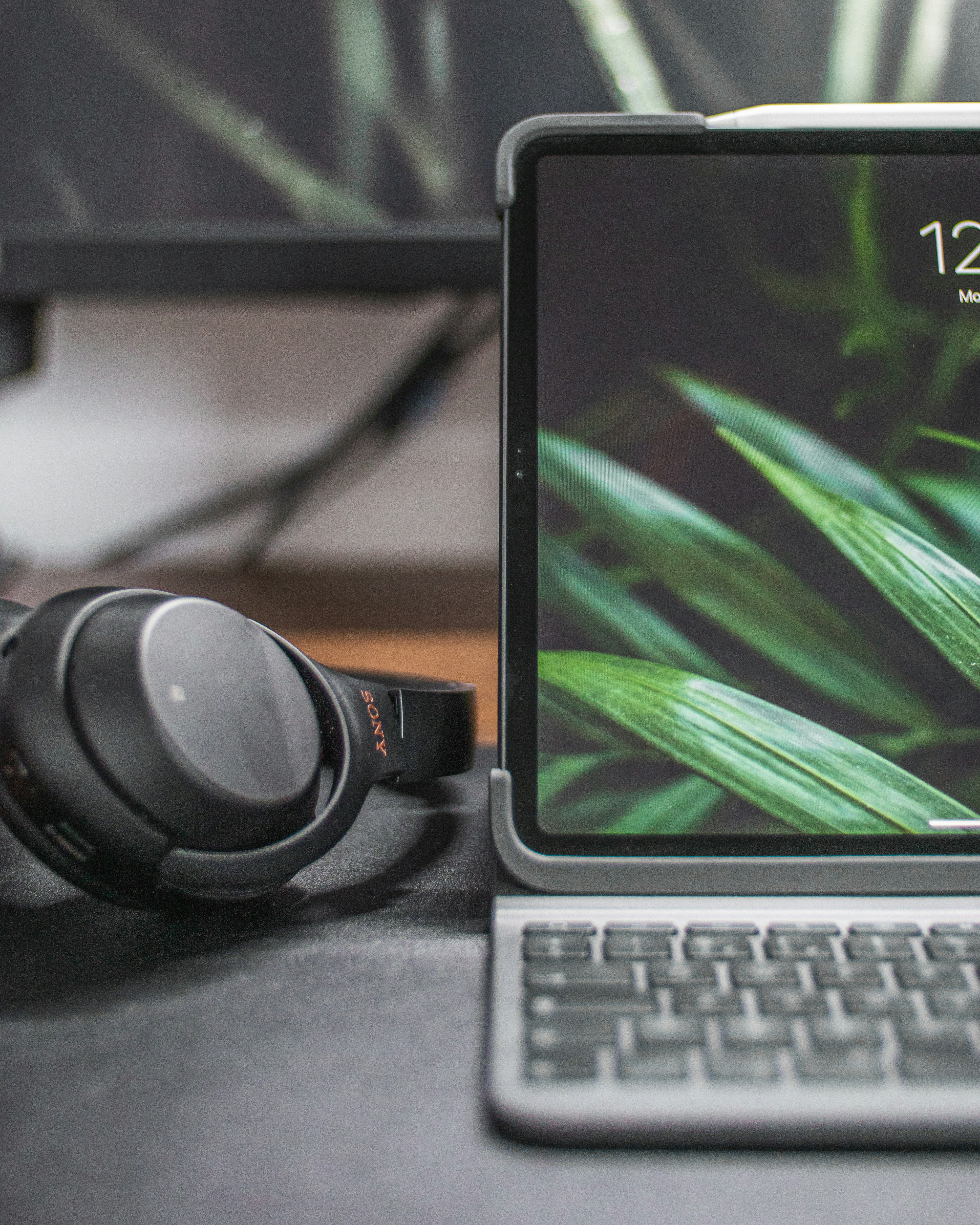 black and silver headphones on black and gray laptop computer