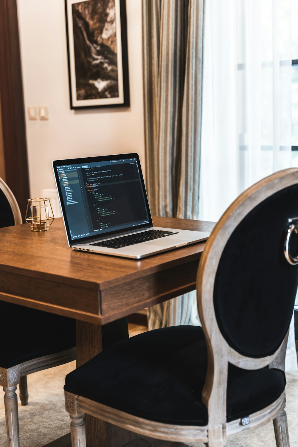 macbook pro on brown wooden table