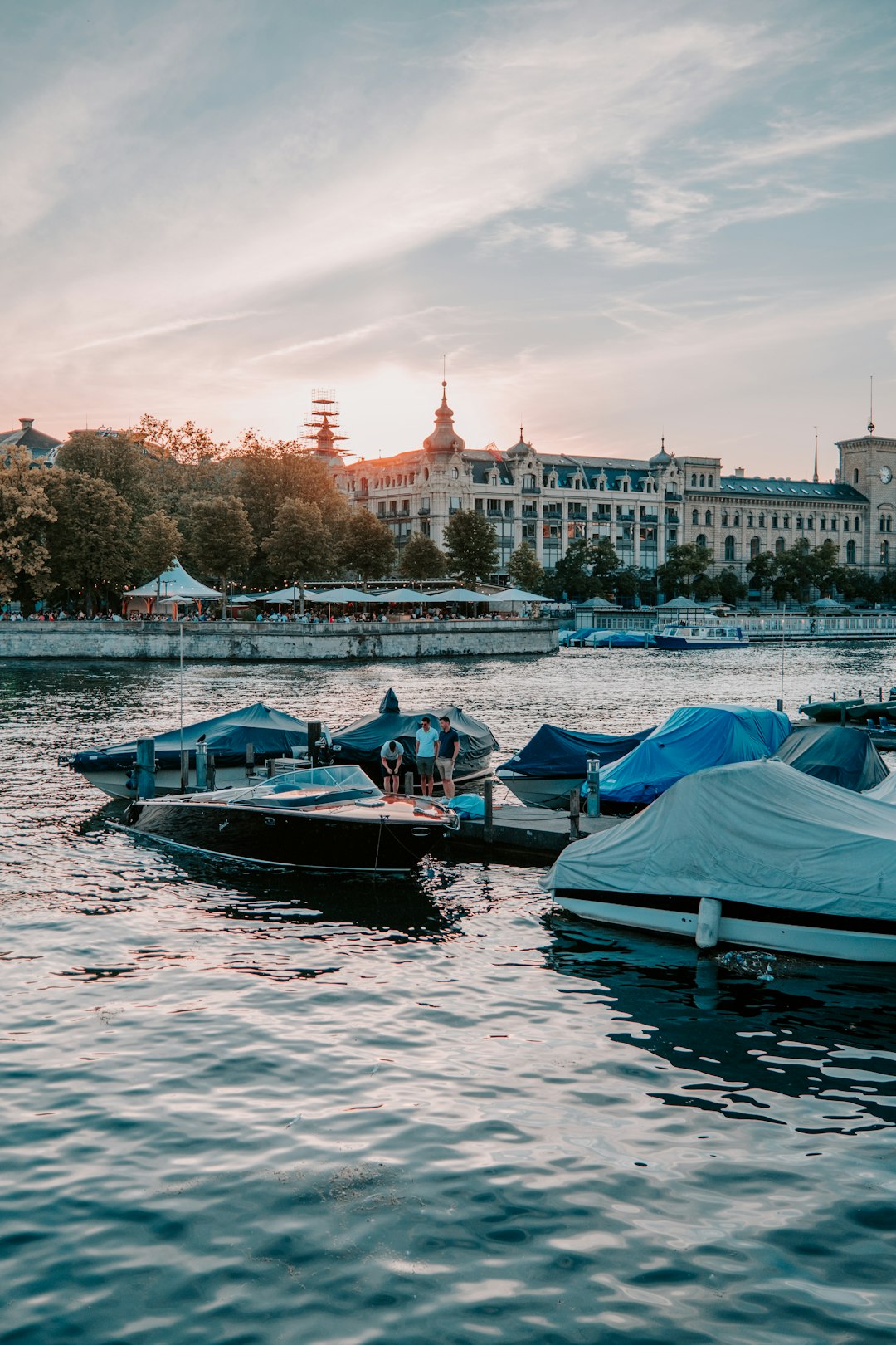 people riding on boat on river during daytime