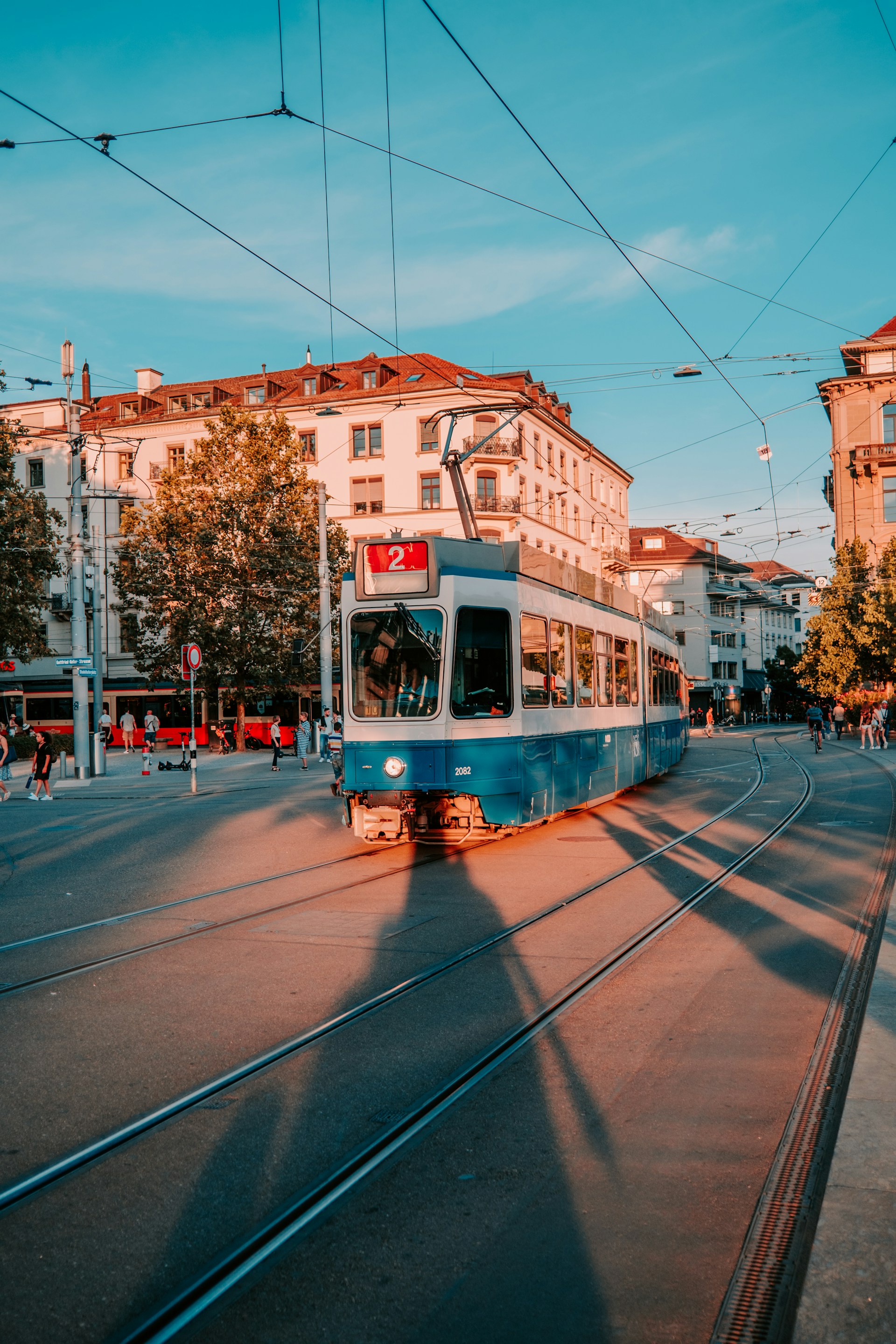 white and red tram on road during daytime