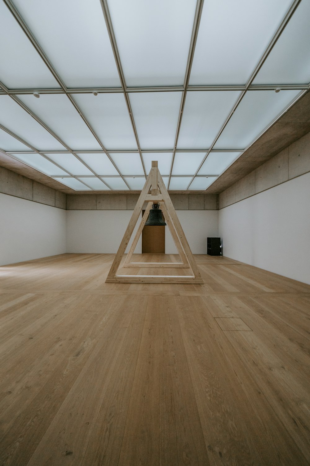 brown wooden floor with white wall