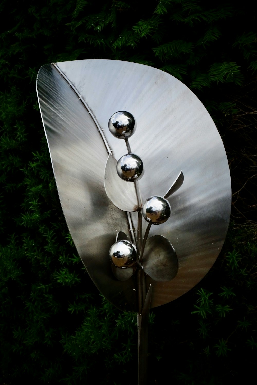 silver round ornament on white round table