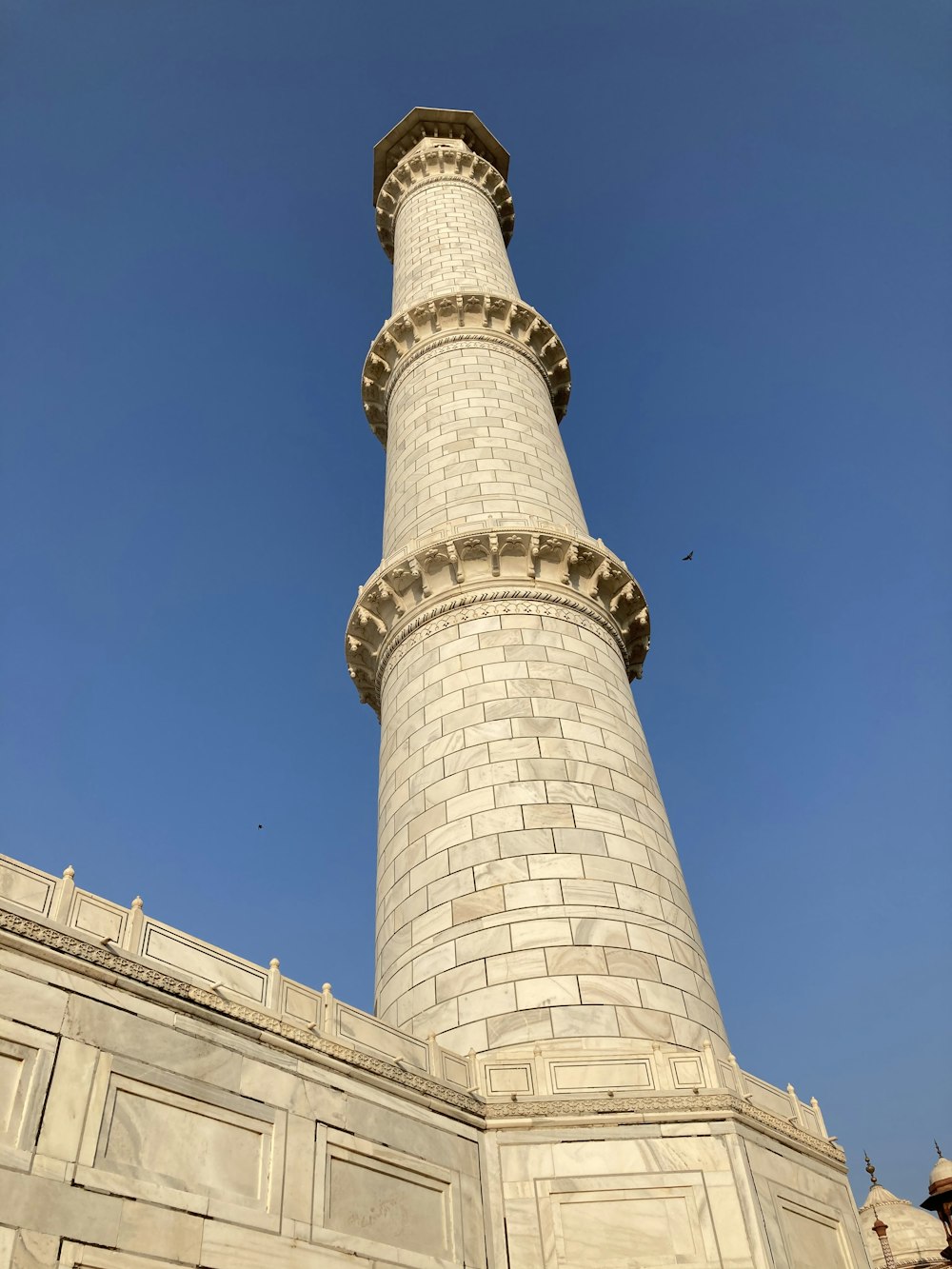 white concrete tower under blue sky during daytime