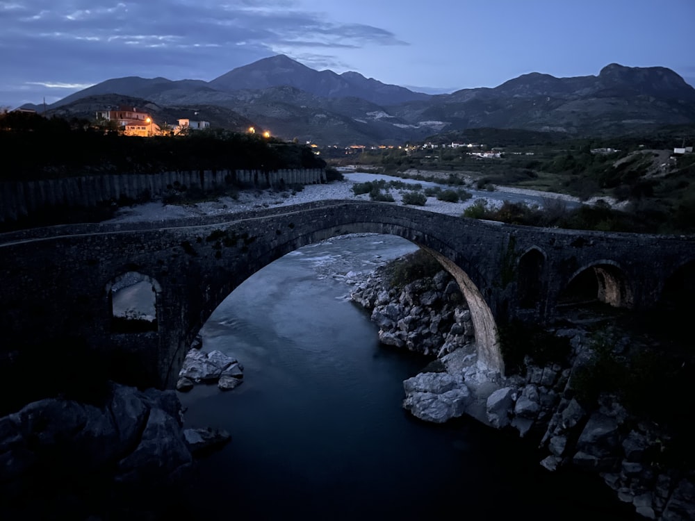 aerial view of bridge over river during night time