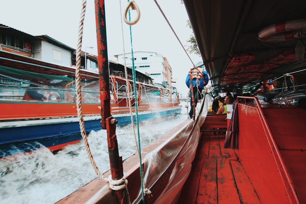 brown wooden boat on body of water during daytime