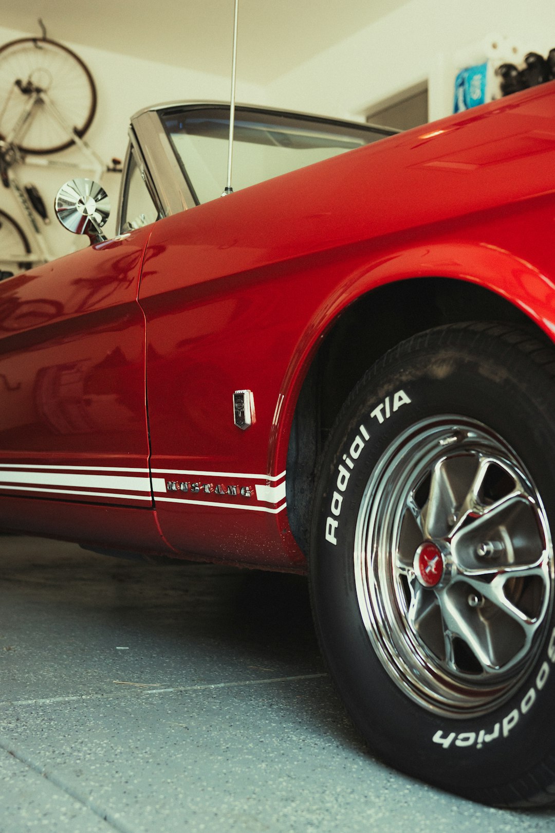 red car on gray concrete floor