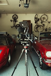 red car parked near black and gray bicycle
