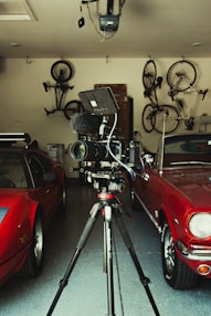 red car parked near black and gray bicycle