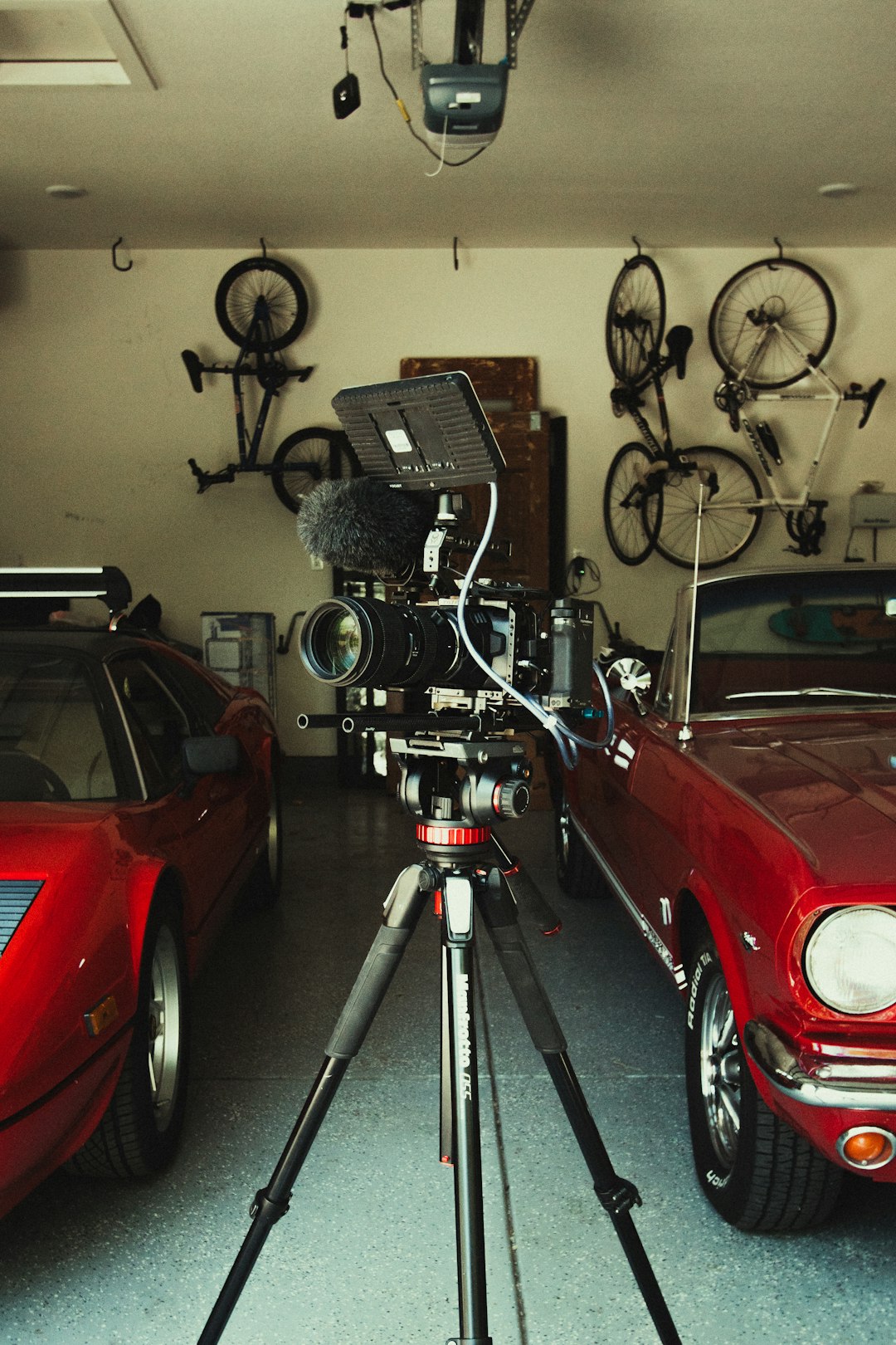 red car parked near black and gray bicycle