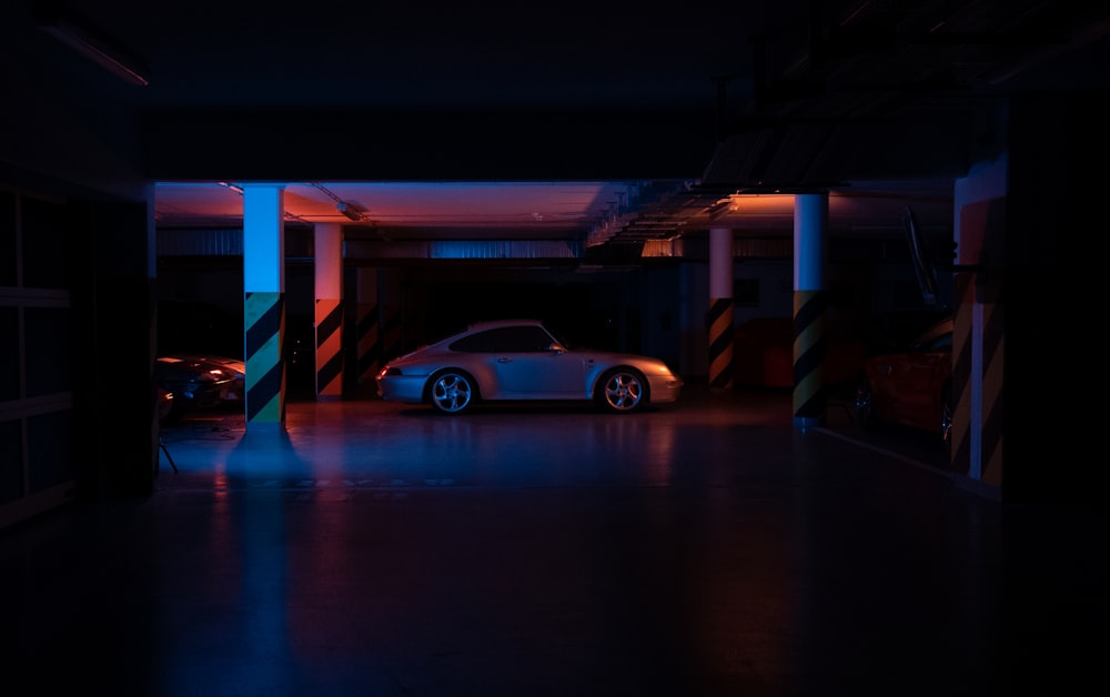 yellow sedan parked near building during night time