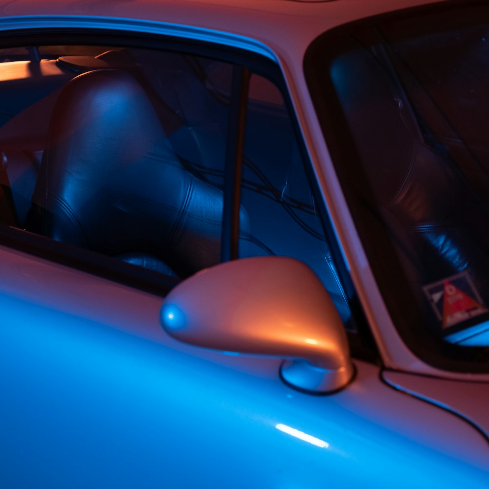 blue car with black steering wheel