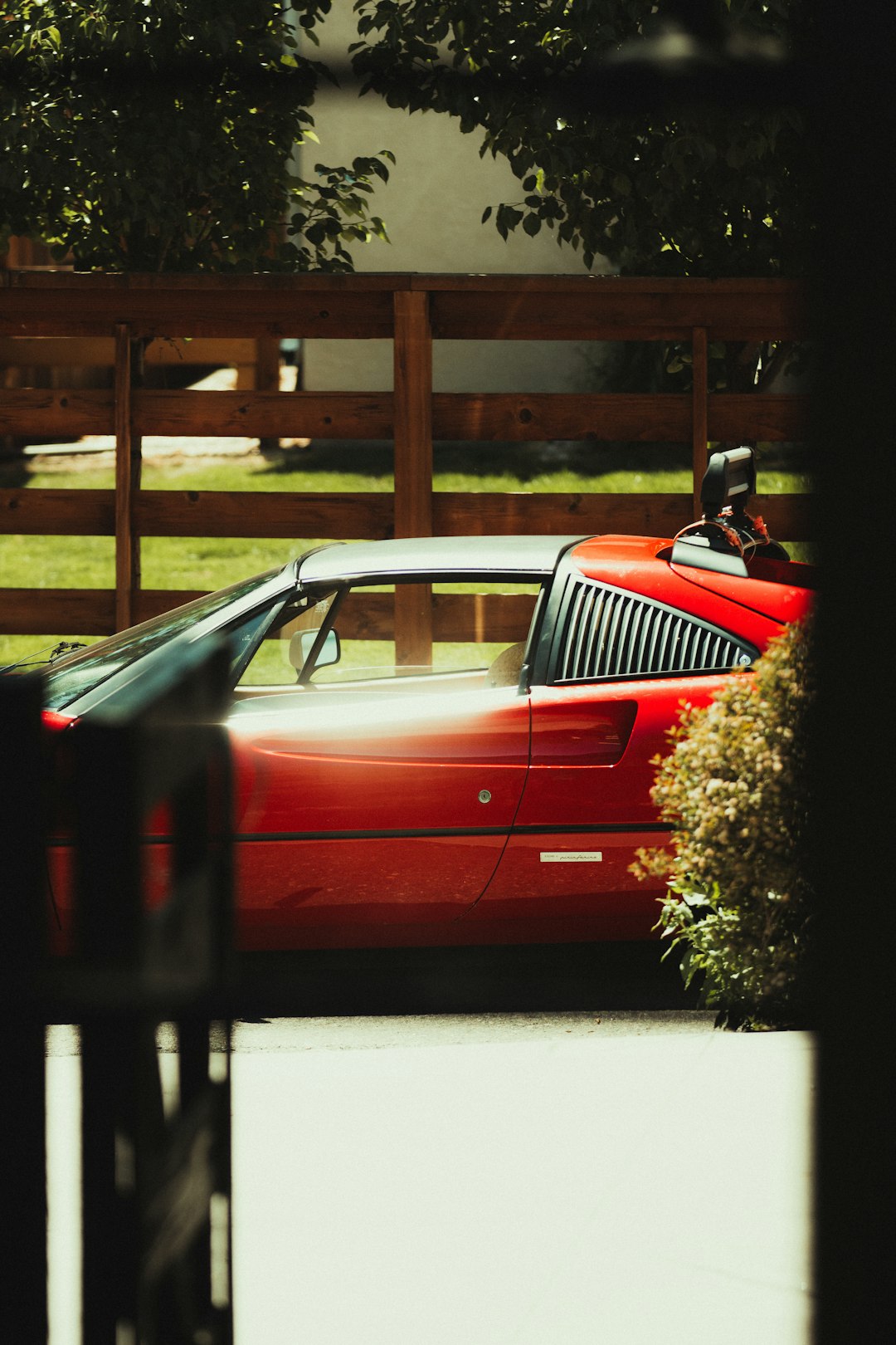 red car parked on the side of the road