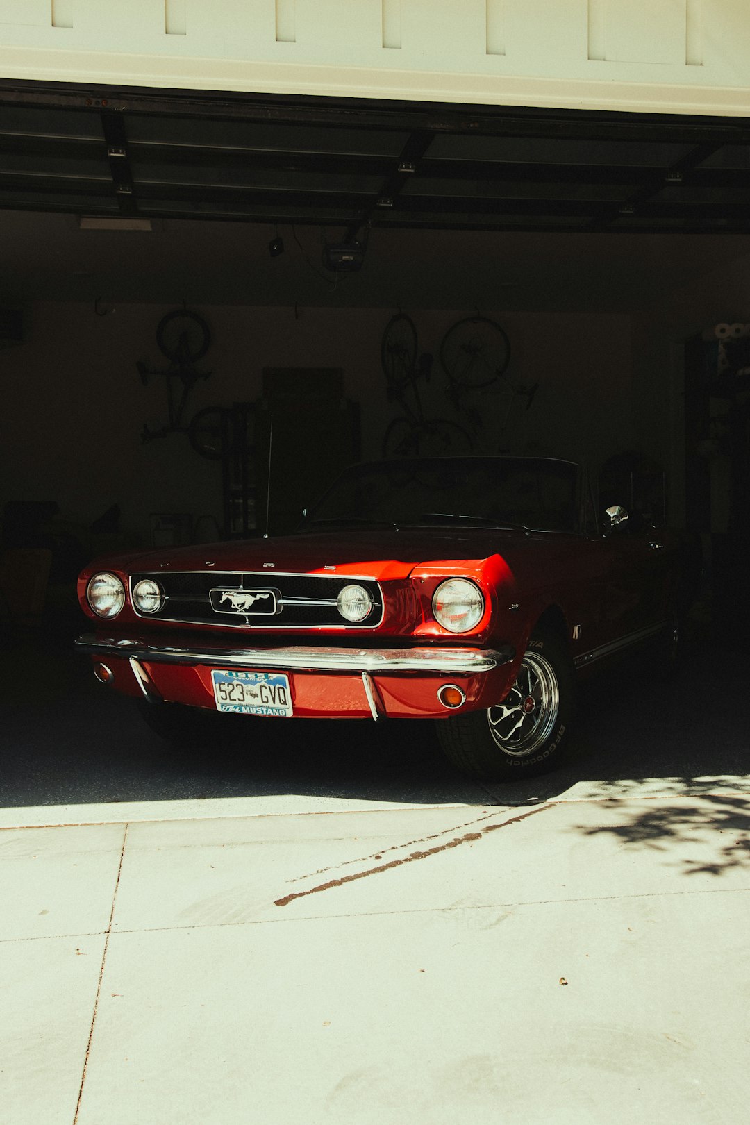 red porsche 911 parked in garage
