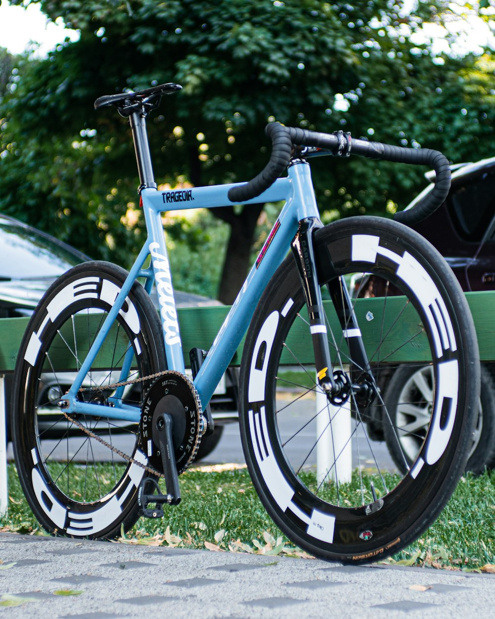 blue and black bicycle on green grass field during daytime