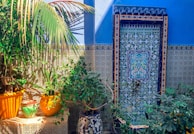A vibrant mosaic side table adorned with plants.