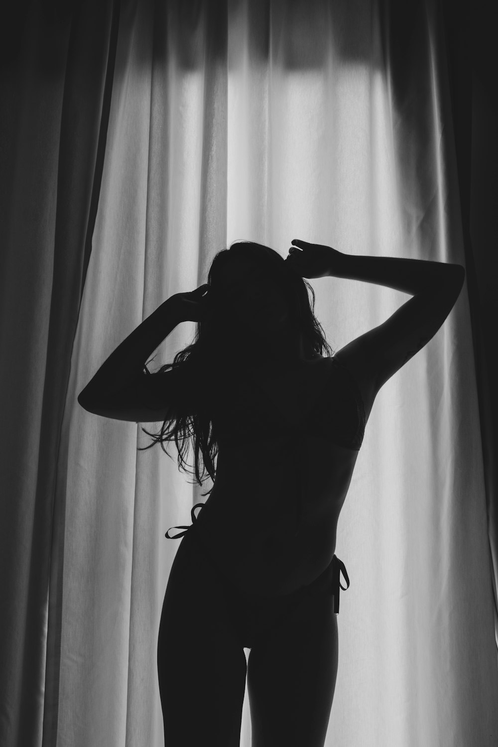 grayscale photo of woman in lace dress